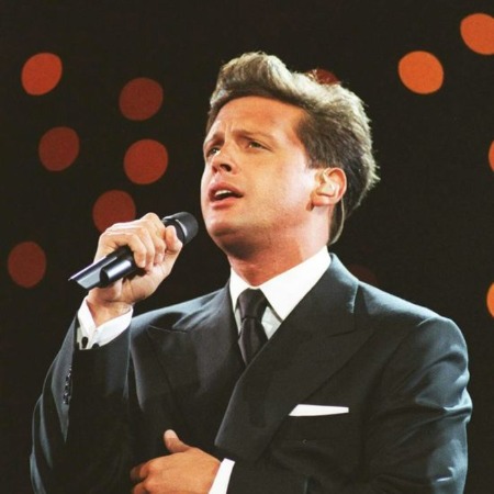Luis Miguel performing on the stage.